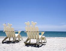 White beach chairs on Captiva Beach