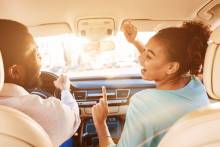 couple singing in car